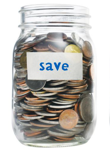 Mason jar filled with coins with "Save" written on piece of masking tape stuck to outside