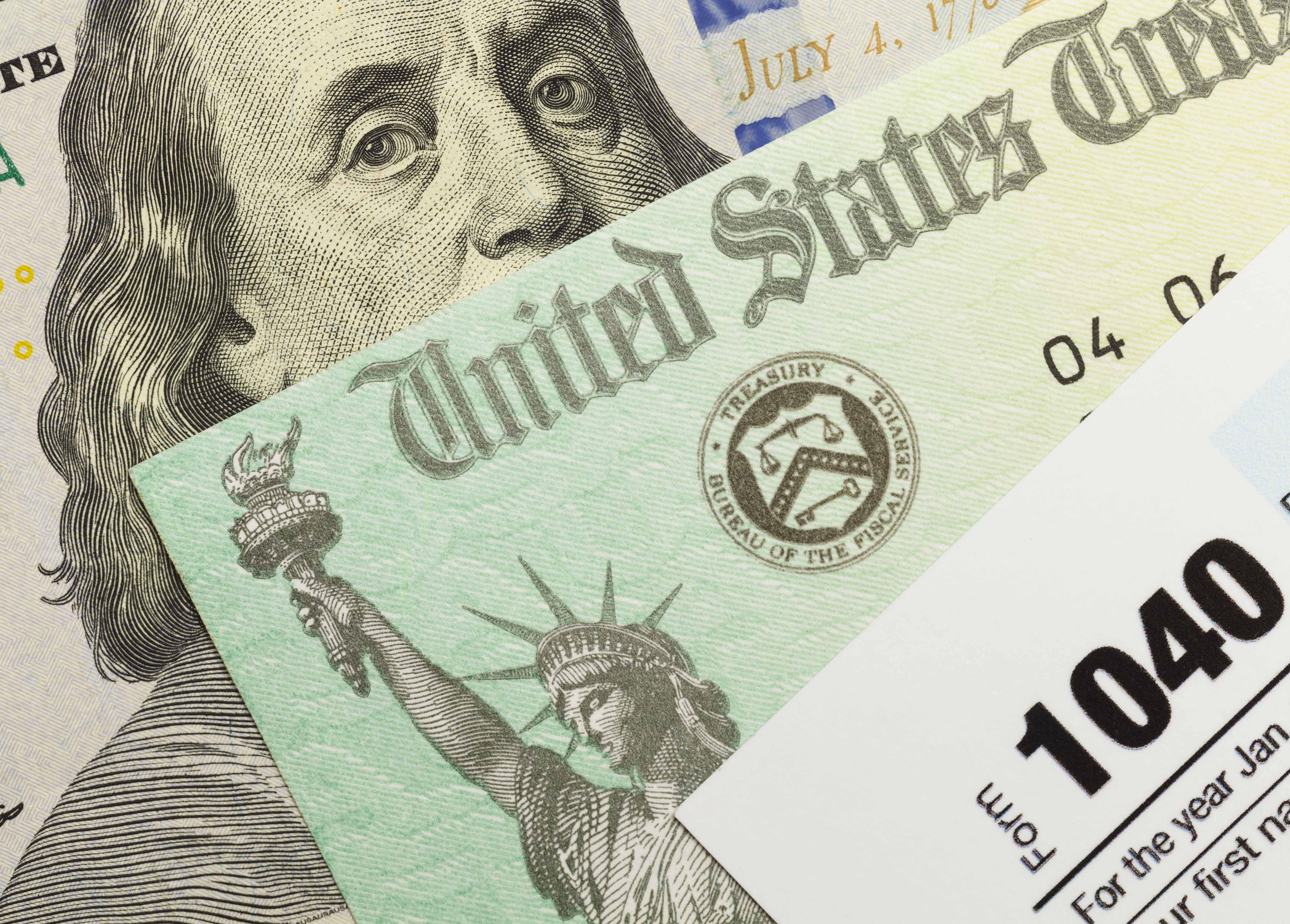 U.S. 1040 form against a backdrop of a U.S. Treasury Check