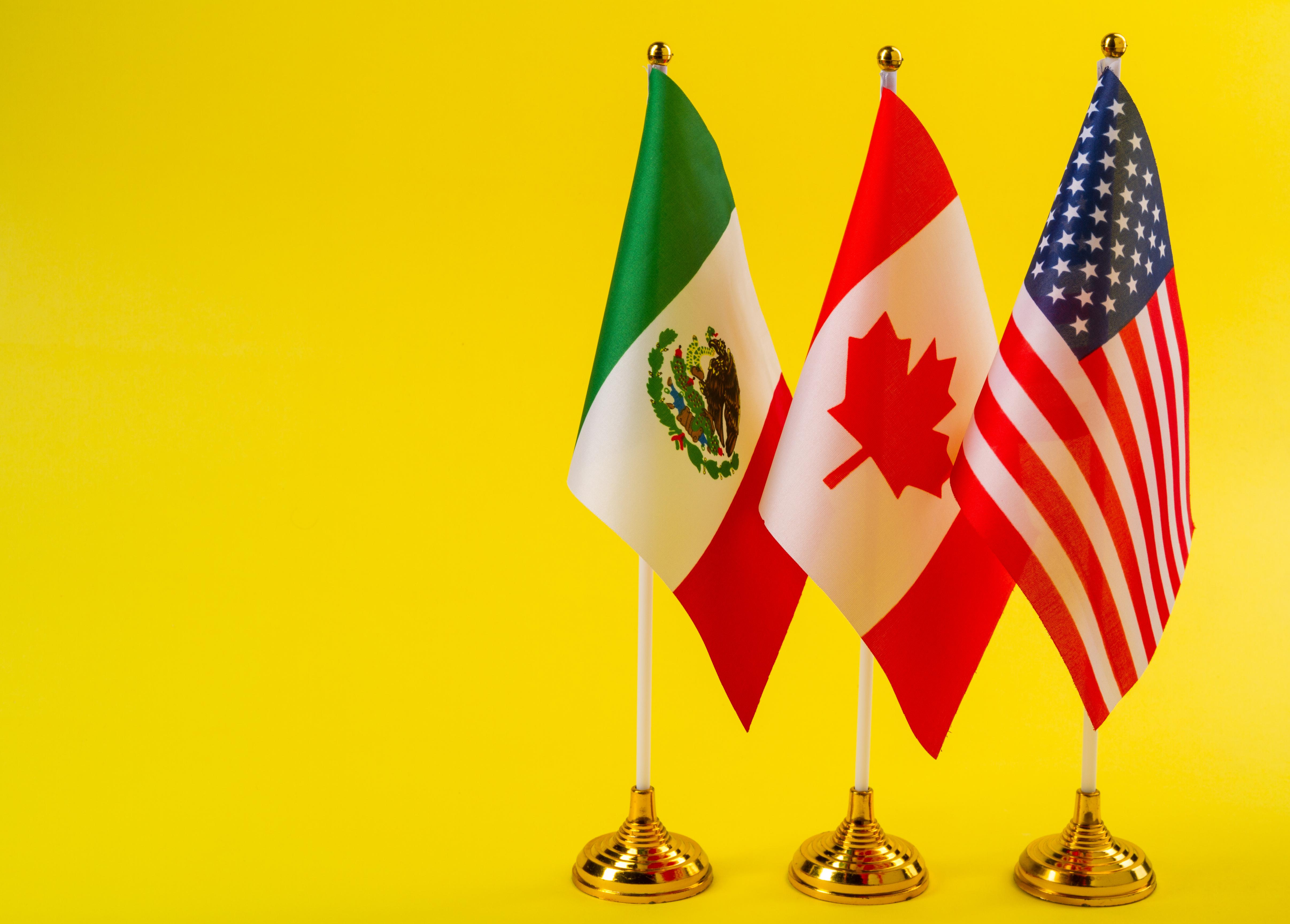 Mexico, Canada, and US flags side by side